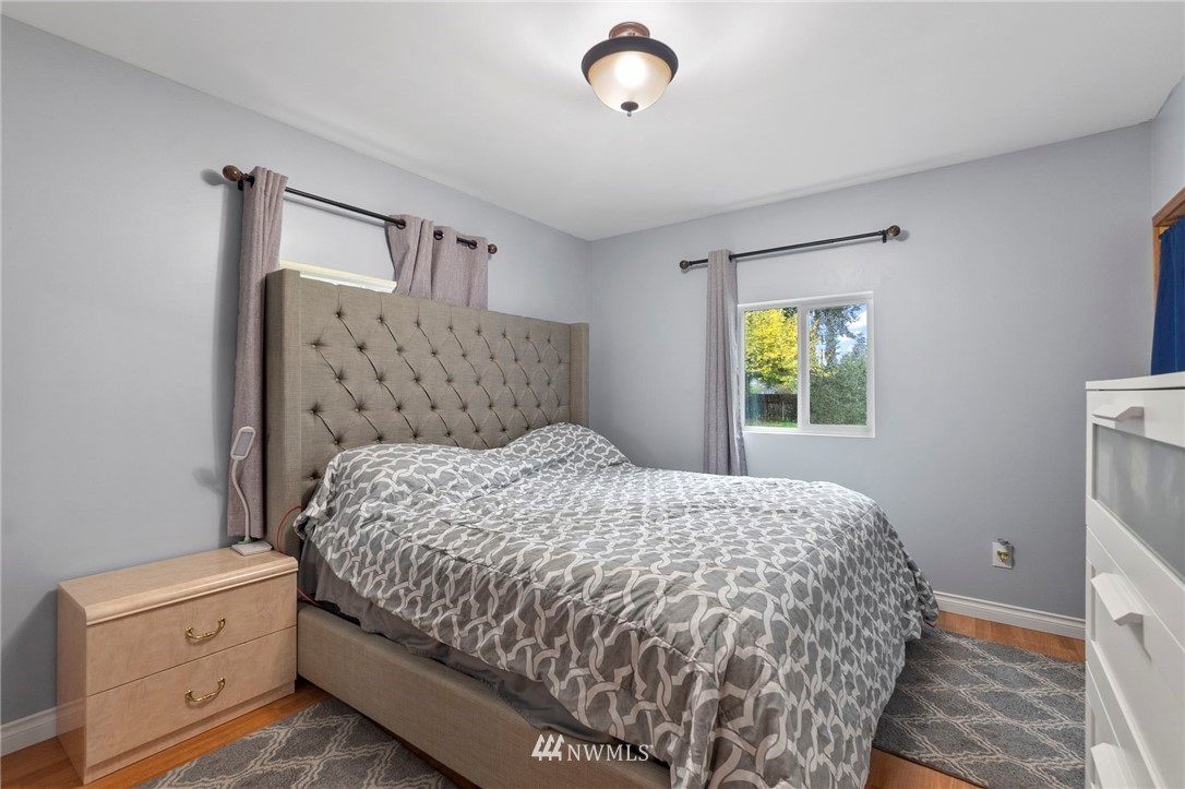 18349 Albany Street Southwest Rochester, WA 98579 - Photo 12 of 21 a bedroom with a bed and a window