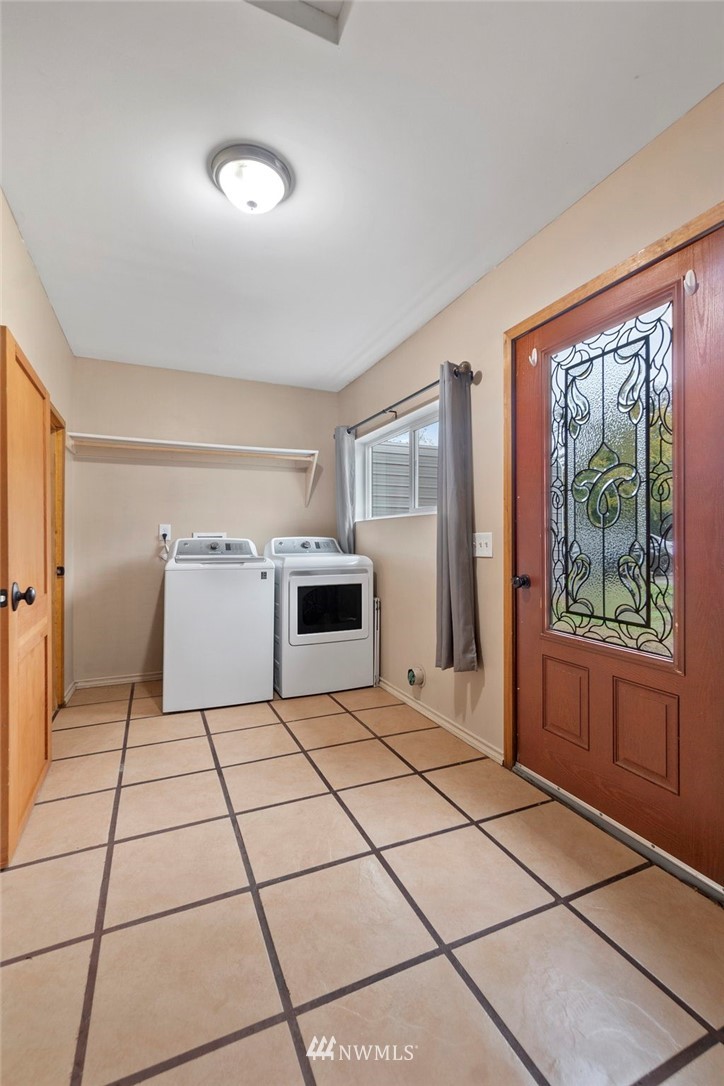 18349 Albany Street Southwest Rochester, WA 98579 - Photo 15 of 21 a kitchen with a stove a sink and a refrigerator