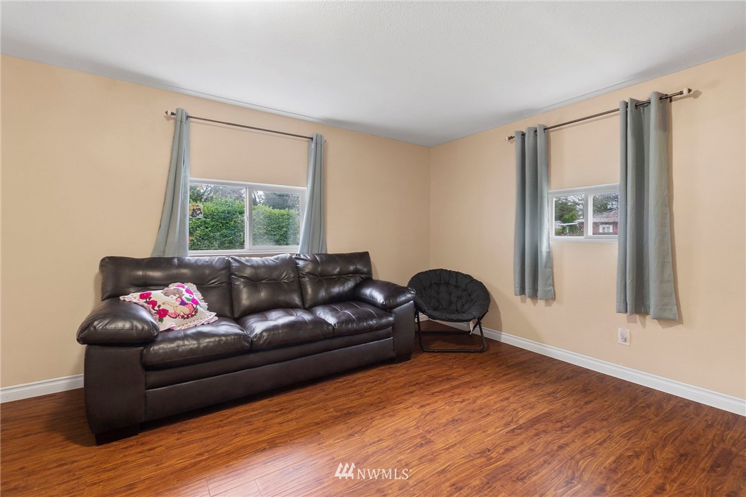 18349 Albany Street Southwest Rochester, WA 98579 - Photo 16 of 21 a living room with furniture window and a wooden floor