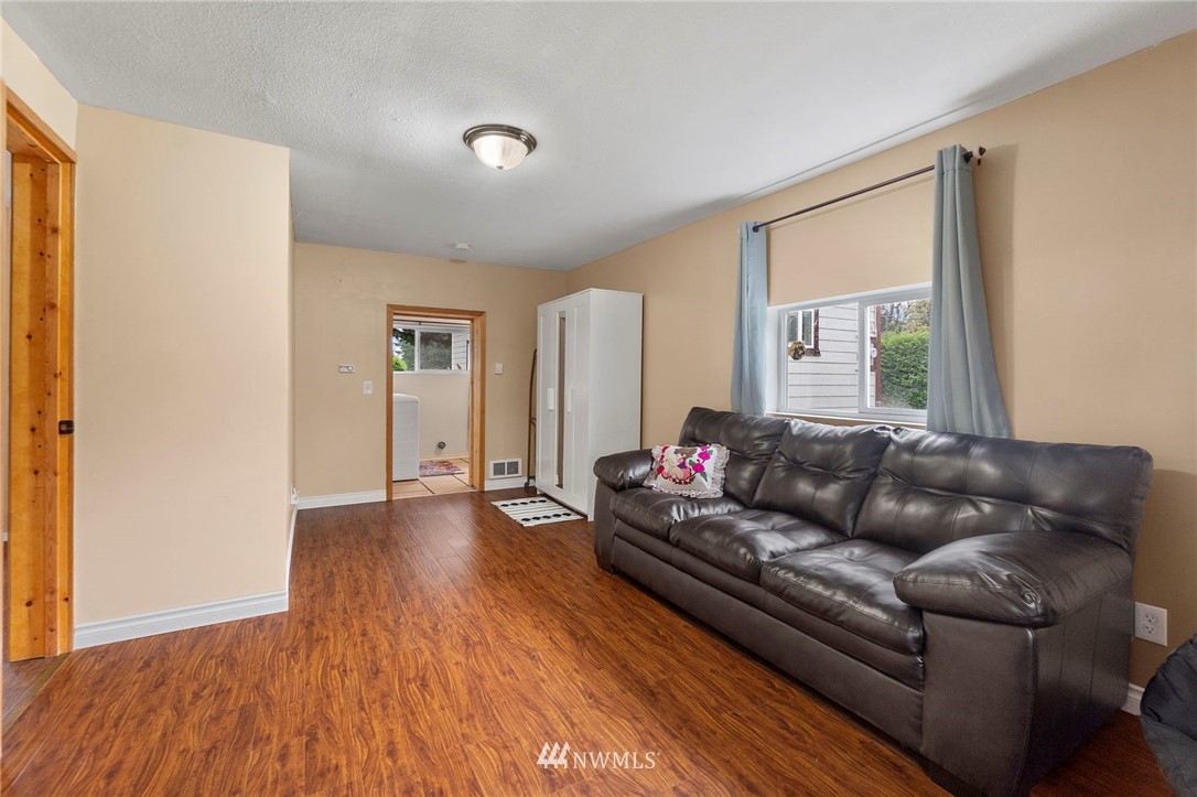 18349 Albany Street Southwest Rochester, WA 98579 - Photo 17 of 21 a living room with furniture and a hard wood floor