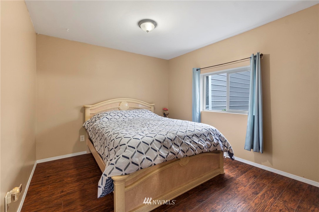 18349 Albany Street Southwest Rochester, WA 98579 - Photo 18 of 21 a bed sitting in a bedroom next to a window
