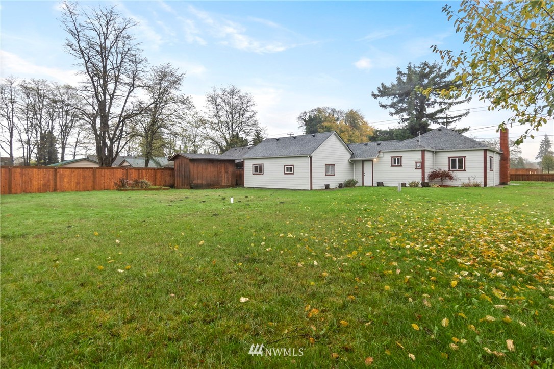 18349 Albany Street Southwest Rochester, WA 98579 - Photo 20 of 21 a view of a house with a big yard and large trees