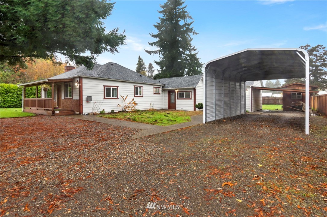 18349 Albany Street Southwest Rochester, WA 98579 - Photo 3 of 21 a front view of a house with a yard and trees
