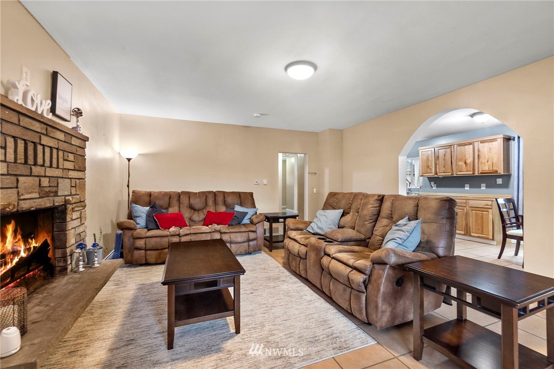 18349 Albany Street Southwest Rochester, WA 98579 - Photo 6 of 21 a living room with furniture and a fireplace