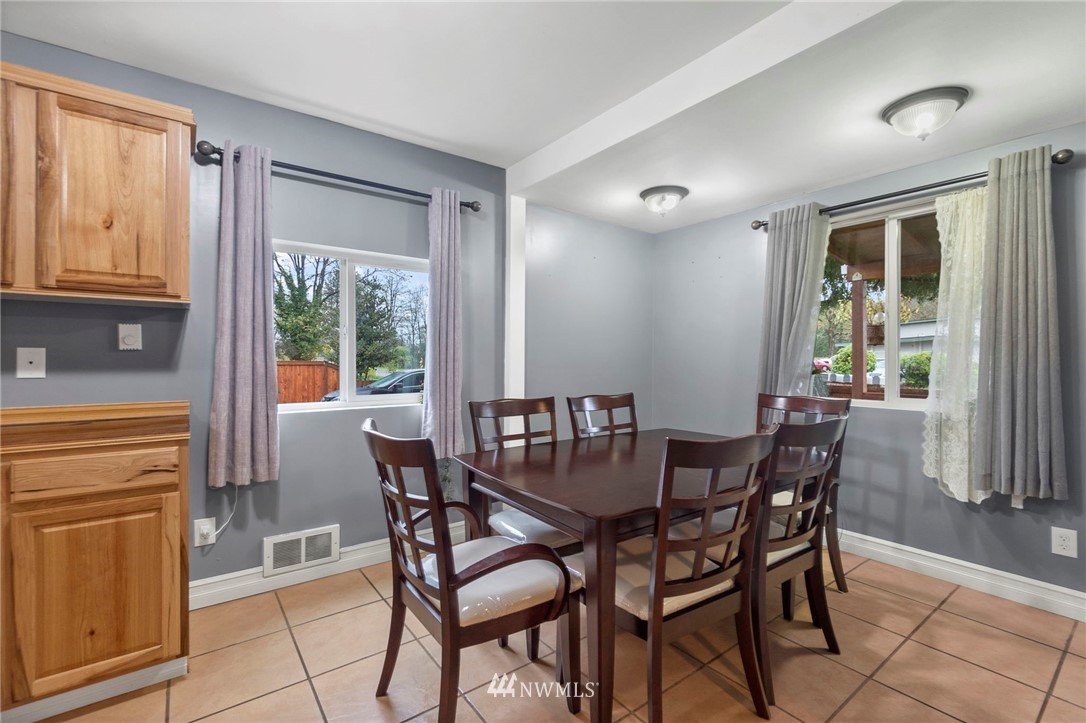 18349 Albany Street Southwest Rochester, WA 98579 - Photo 7 of 21 a view of a dining room with furniture window and outside view