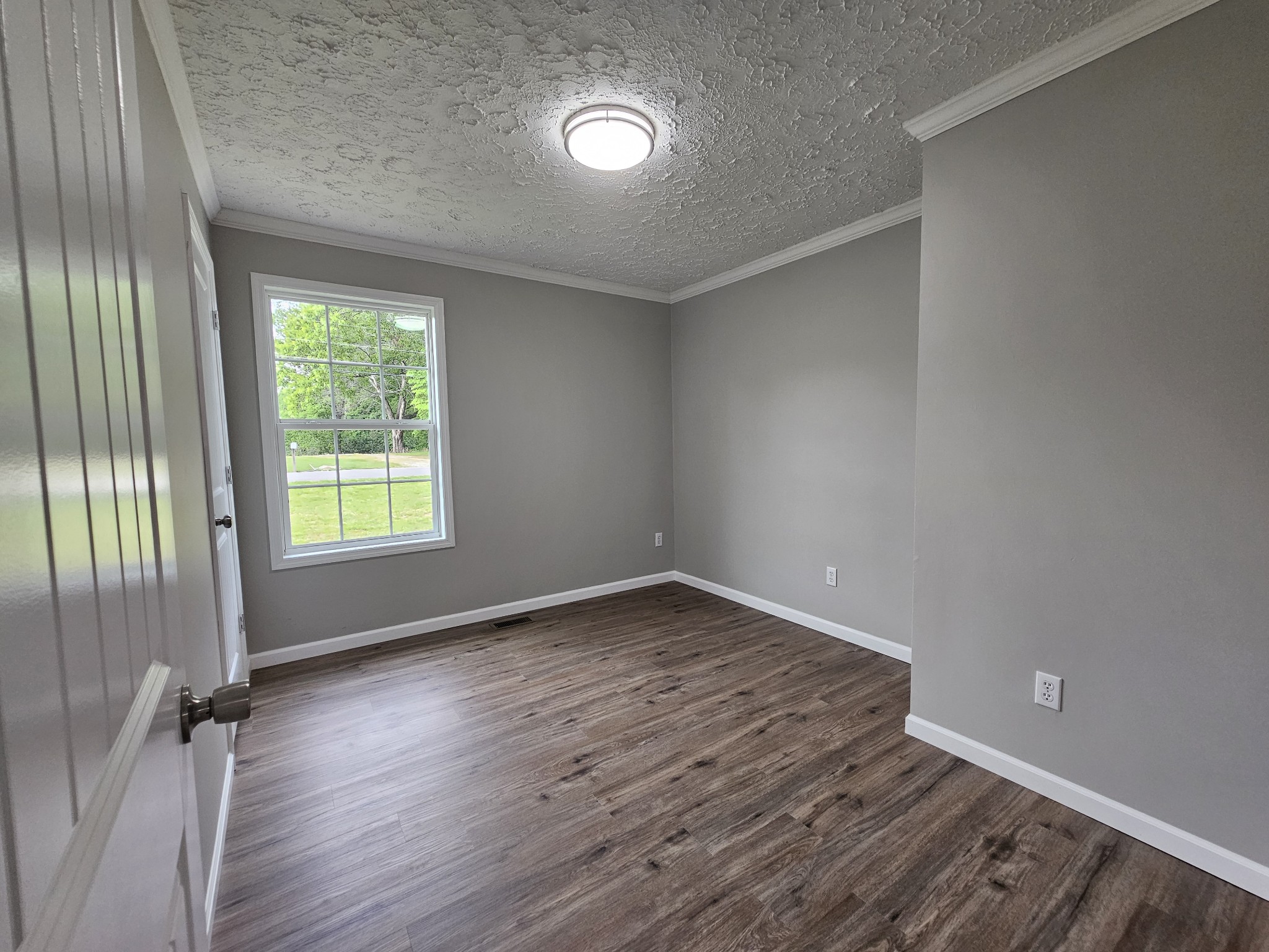 362 Forest Point Road Monteagle, TN 37356 - Photo 38 of 42 wooden floor in an empty room with a window