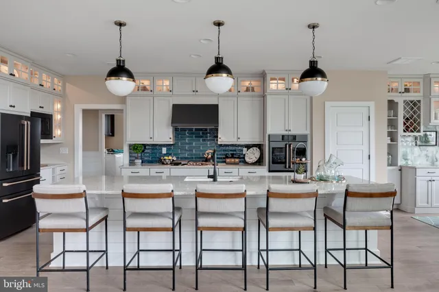 a dining room with furniture and chandelier