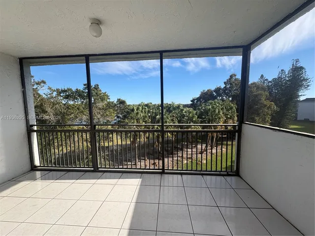 a view of hallway with windows