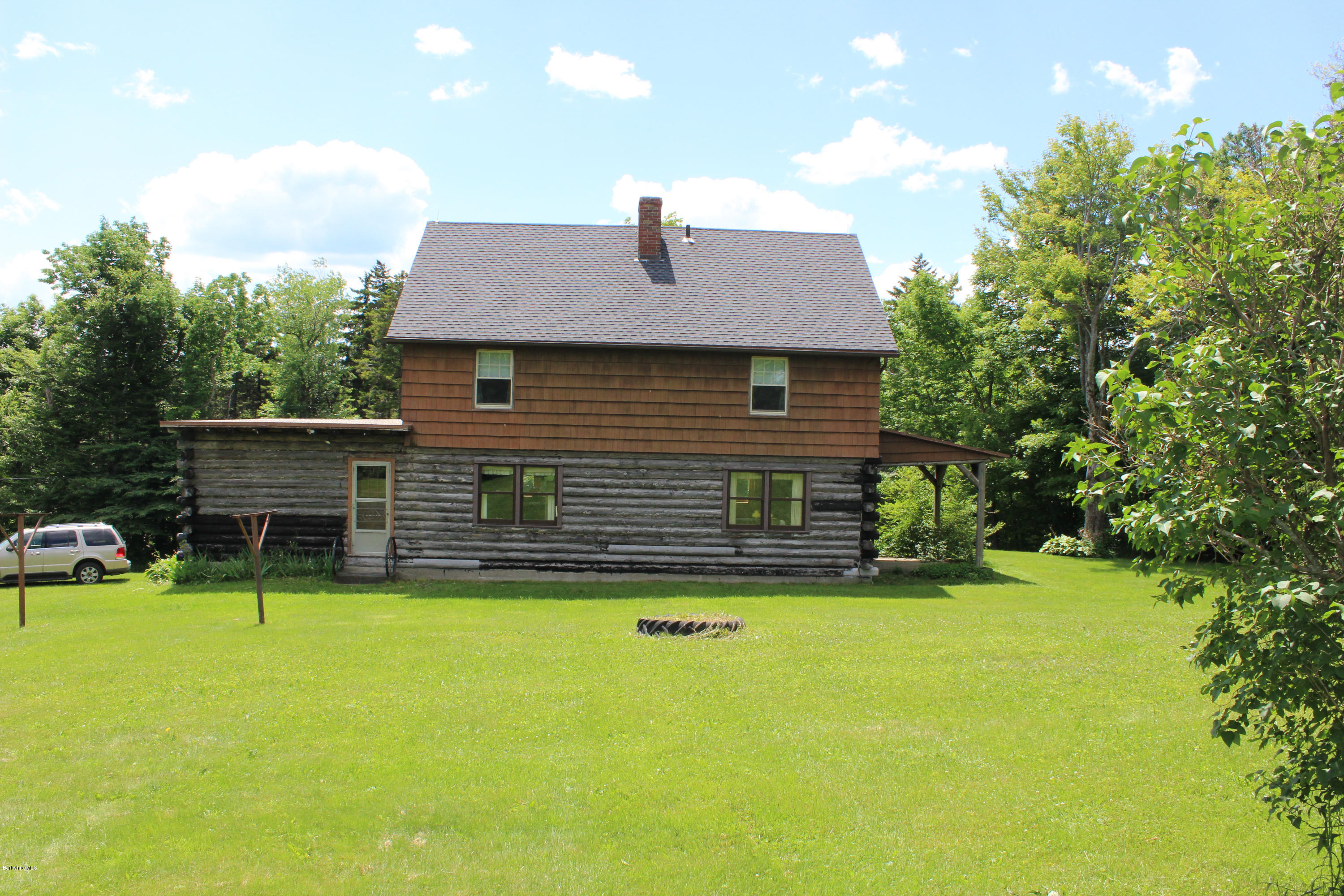 535 Peru Road Windsor, MA 01270 - Photo 3 of 12 a front view of a house with a yard