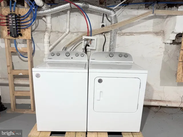 a utility room with dryer and washer