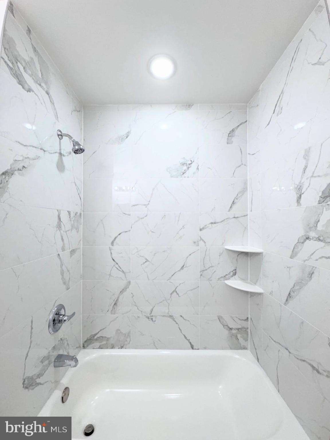 319 East Lehigh Avenue, Unit 1 Philadelphia, PA 19125 - Photo 6 of 21 a bathroom with a bathtub and shower