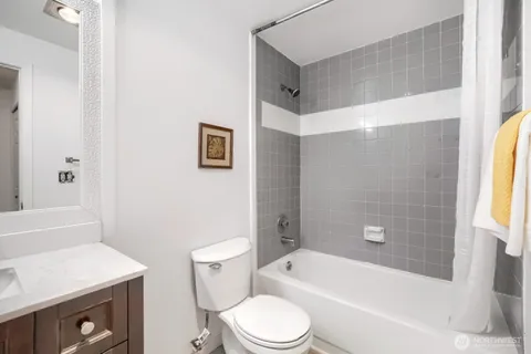 a bathroom with a toilet a sink and bathtub