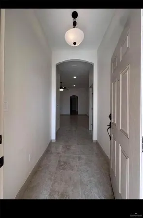 a view of a hallway with a chandelier