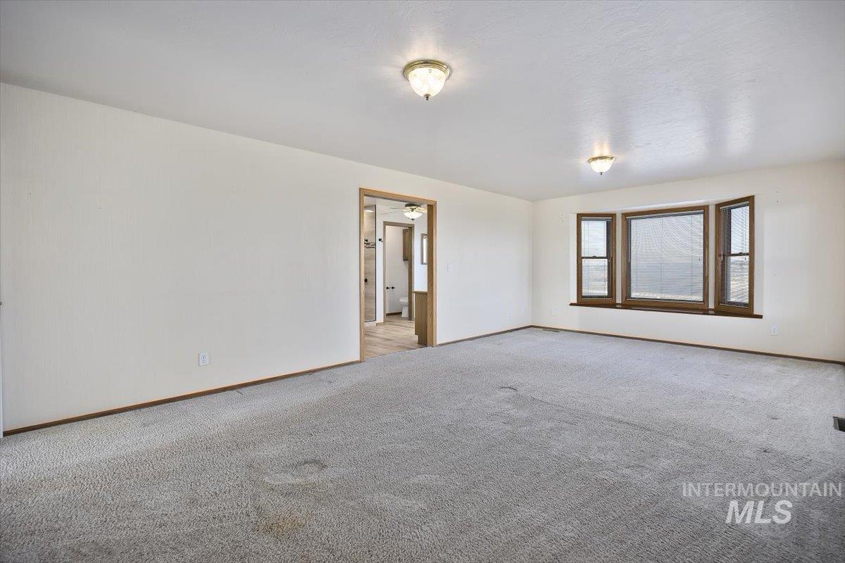 474 Kay Drive Twin Falls, ID 83301 - Photo 16 of 38 Spare room with baseboards and carpet floors