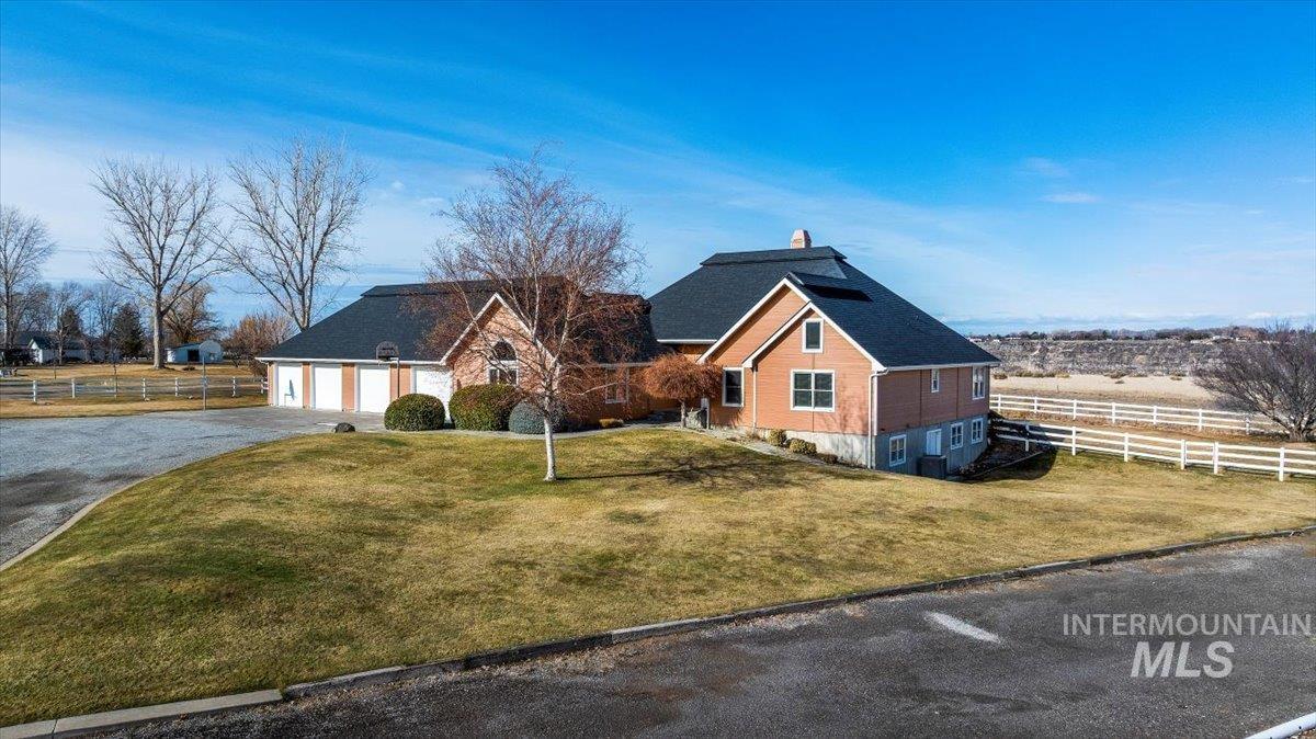 474 Kay Drive Twin Falls, ID 83301 - Photo 2 of 38 View of front of property with driveway, a chimney, and a garage