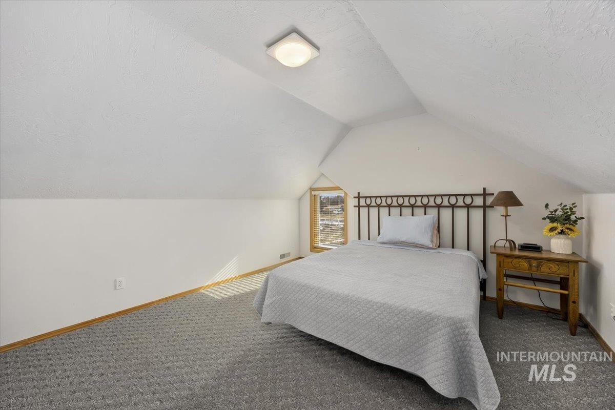 474 Kay Drive Twin Falls, ID 83301 - Photo 24 of 38 Bedroom with carpet floors and a textured ceiling