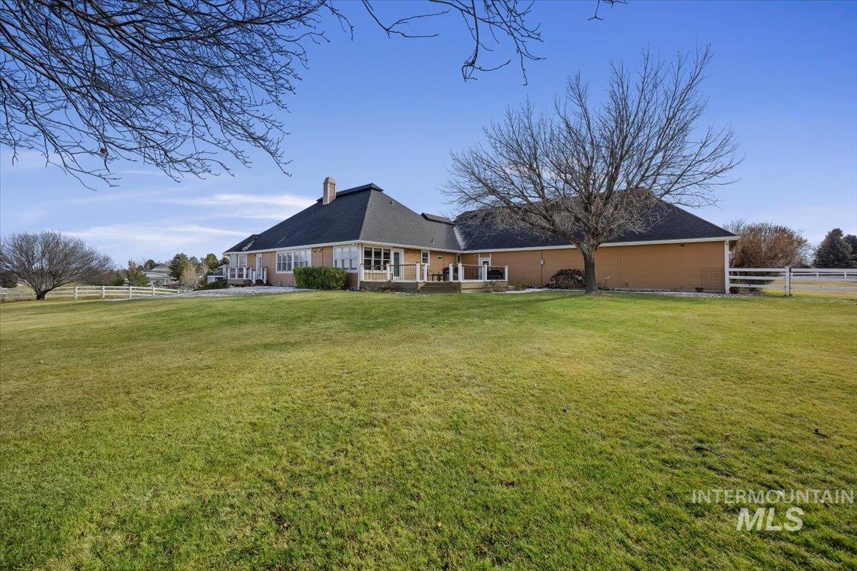 474 Kay Drive Twin Falls, ID 83301 - Photo 31 of 38 Rear view of property featuring a patio area and a chimney