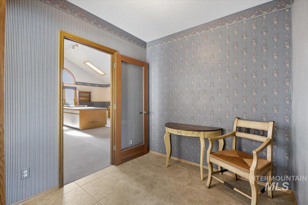 474 Kay Drive Twin Falls, ID 83301 - Photo 8 of 38 Sitting room with wallpapered walls, tile patterned floors, and carpet flooring