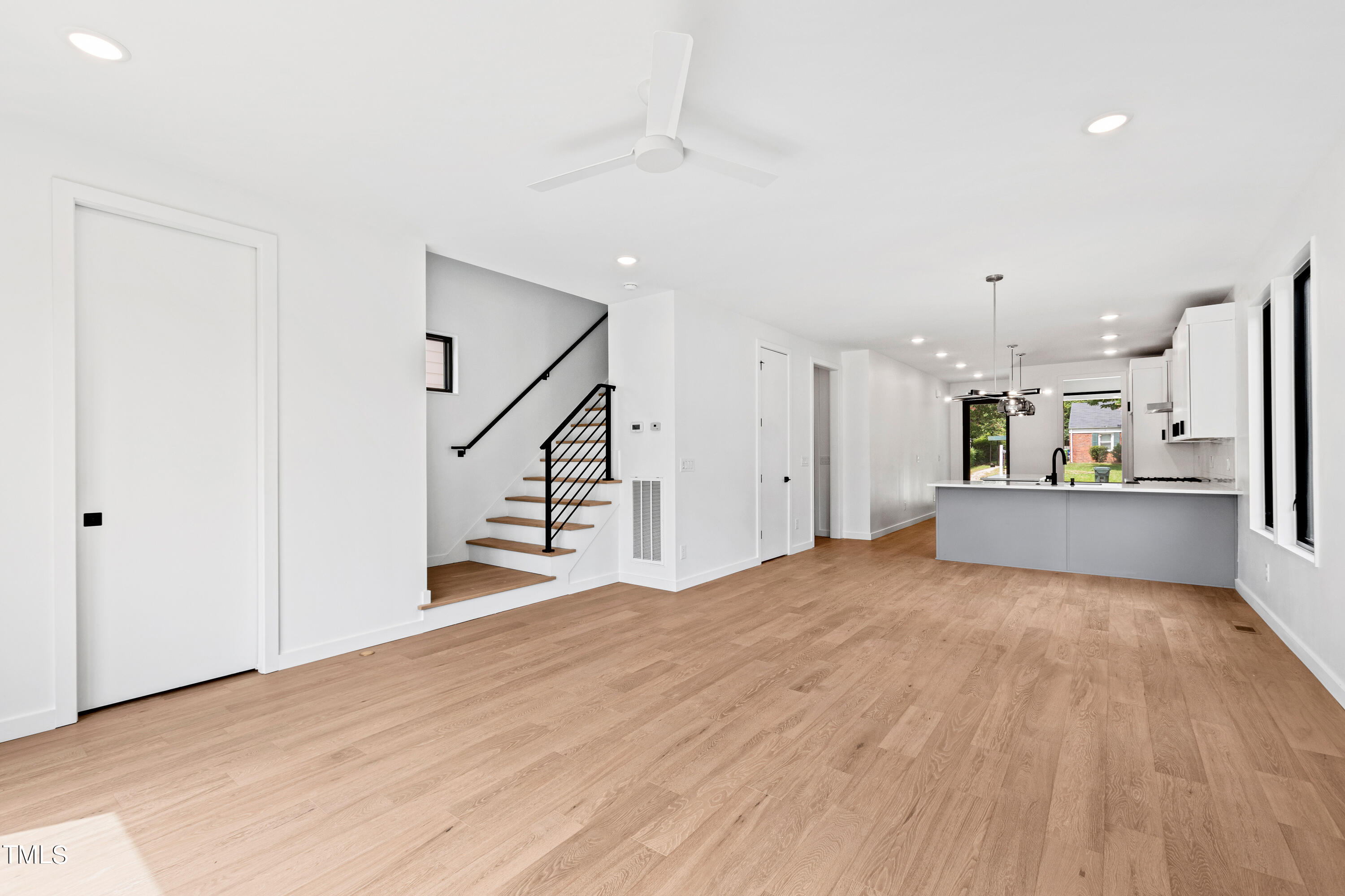 716 Brighton Road, Unit 101 Raleigh, NC 27610 - Photo 11 of 67 a view of a kitchen with wooden floor and electronic appliances