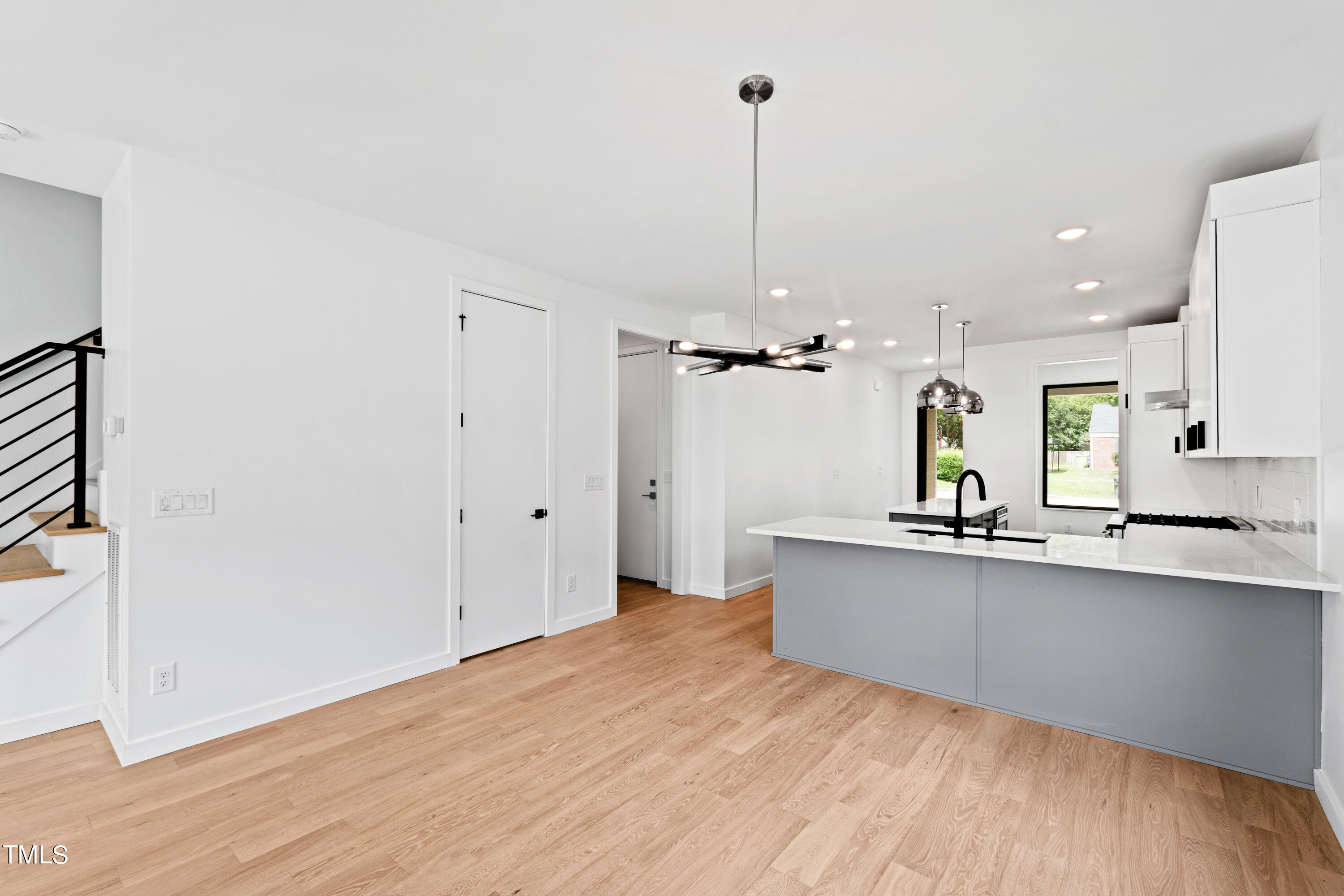 716 Brighton Road, Unit 101 Raleigh, NC 27610 - Photo 22 of 67 a view of a kitchen with a sink stainless steel appliances and cabinets
