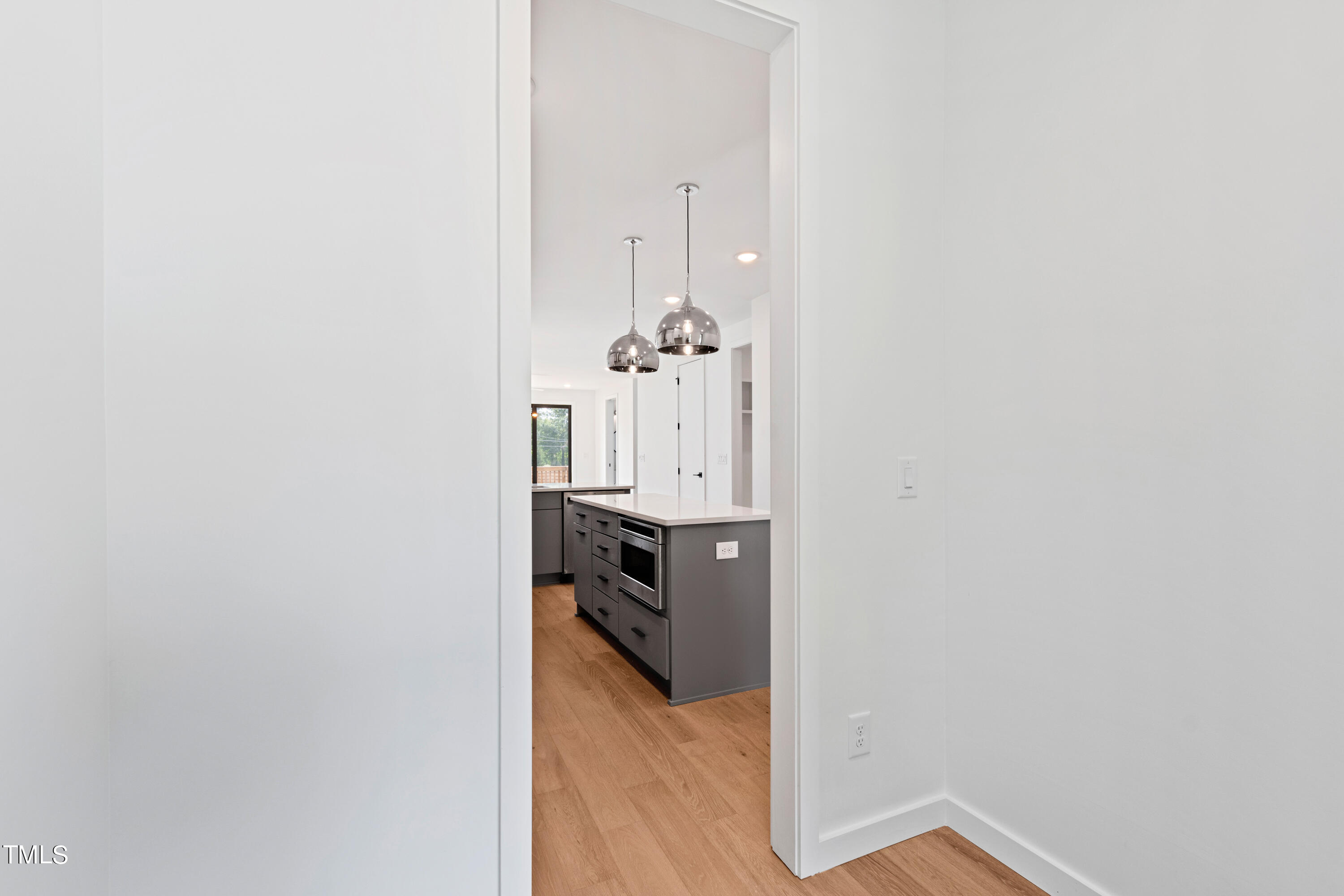 716 Brighton Road, Unit 101 Raleigh, NC 27610 - Photo 26 of 67 a view of a room with wooden floor