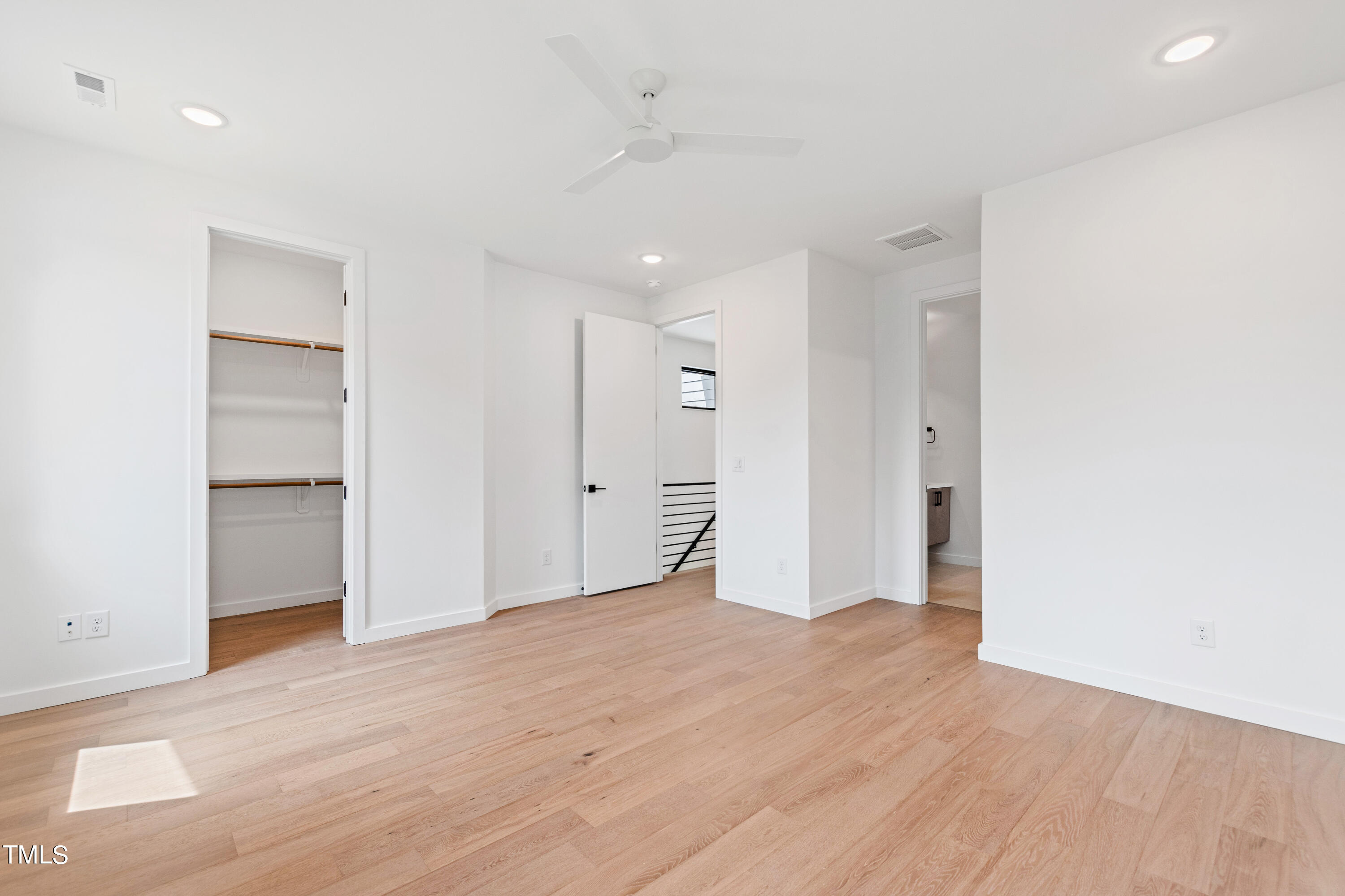 716 Brighton Road, Unit 101 Raleigh, NC 27610 - Photo 36 of 67 a view of an empty room with wooden floor