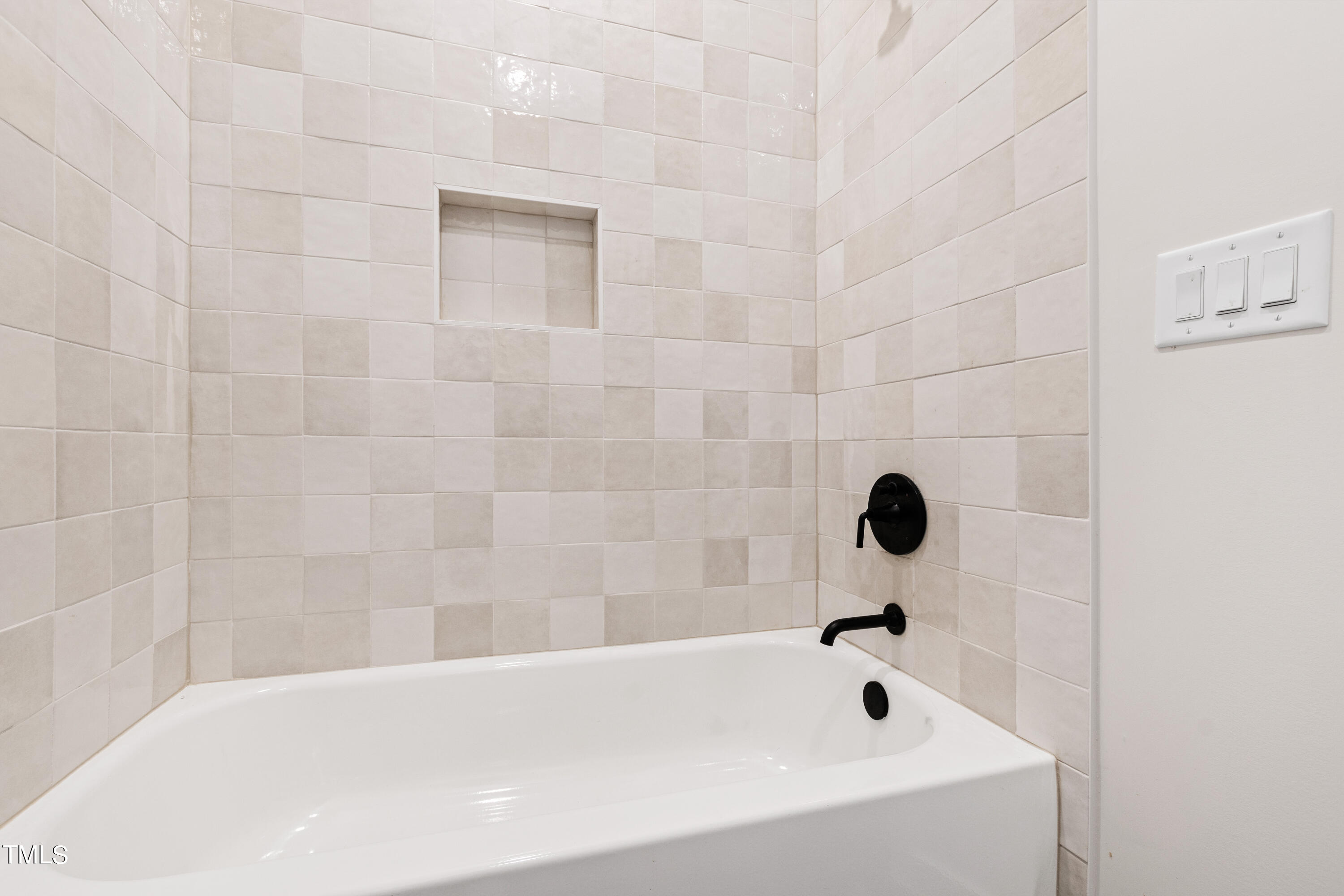 716 Brighton Road, Unit 101 Raleigh, NC 27610 - Photo 52 of 67 a bathroom with a bathtub