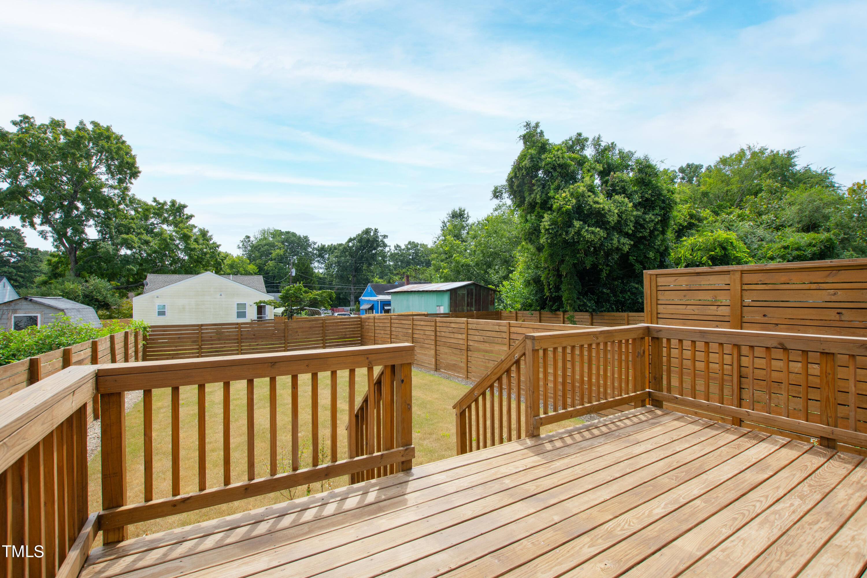 716 Brighton Road, Unit 101 Raleigh, NC 27610 - Photo 62 of 67 a view of deck and deck with wooden floor and fence