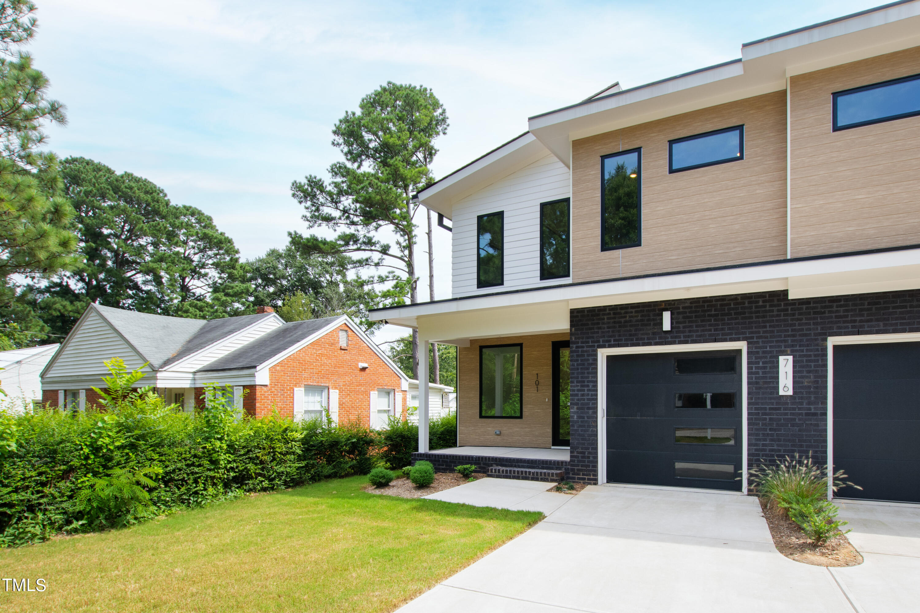 716 Brighton Road, Unit 101 Raleigh, NC 27610 - Photo 66 of 67 a front view of a house with garden