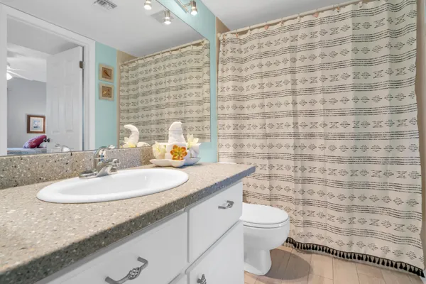 a front view of a house with table and chair