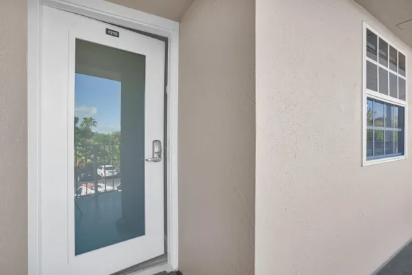 a kitchen with kitchen island granite countertop a stove and a sink