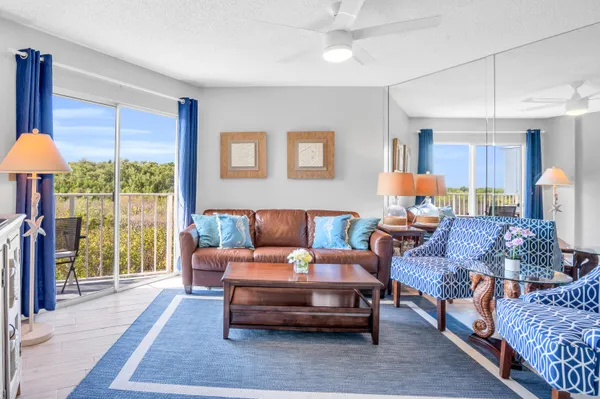 a swimming pool with outdoor seating and yard