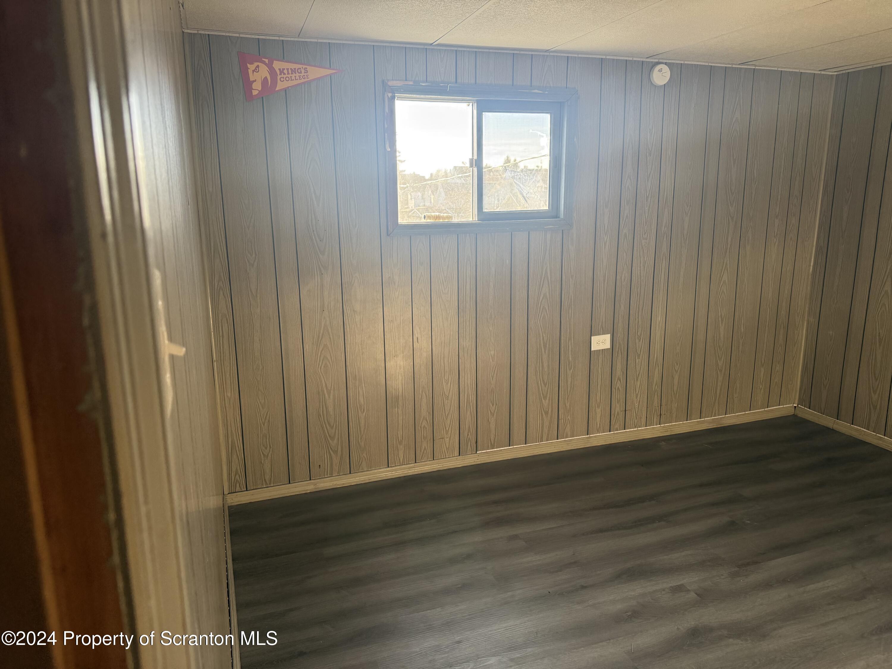 1413 Swetland Street Scranton, PA 18504 - Photo 8 of 9 a view of an empty room with wooden floor