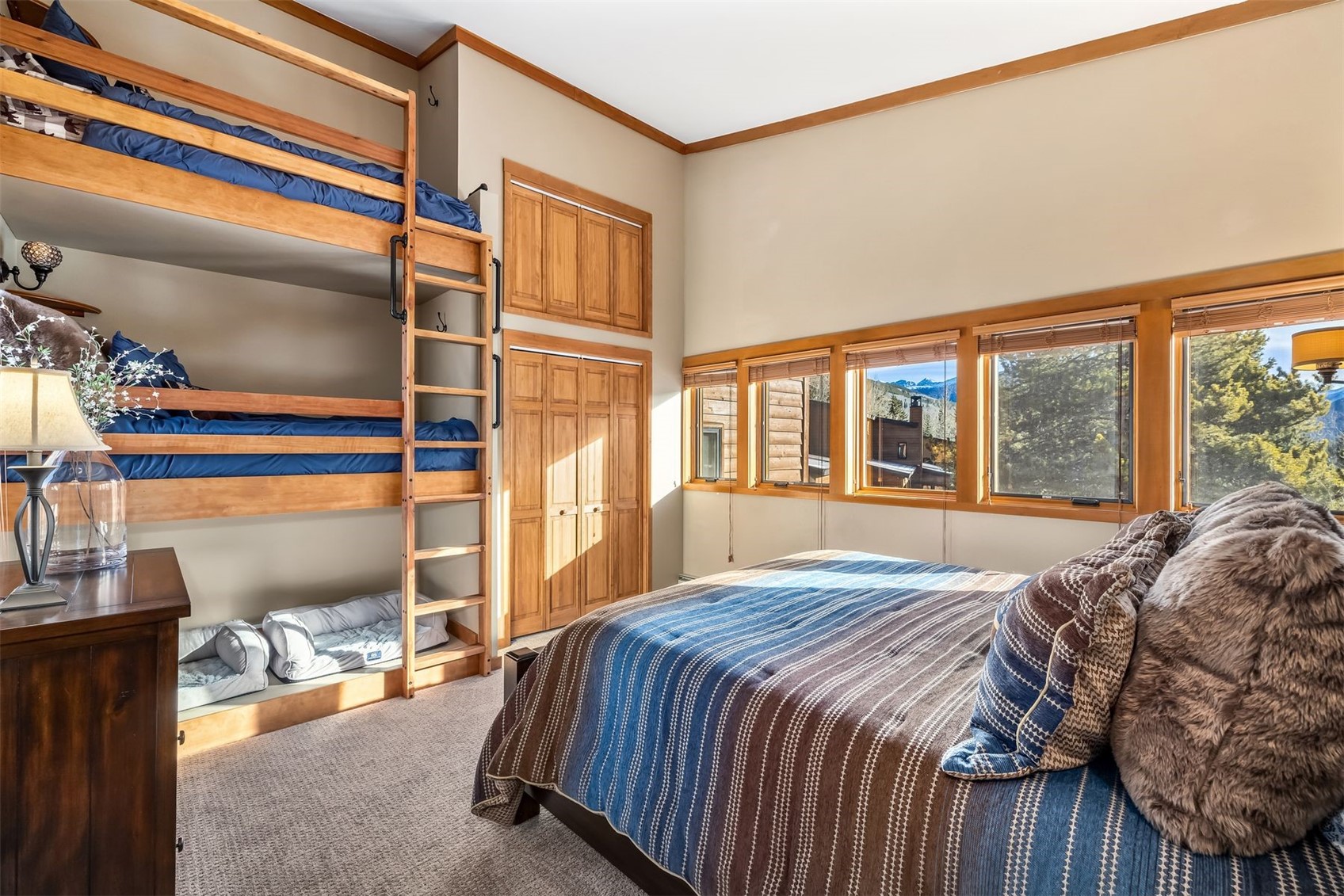 410 Tennis Club Road, Unit 1317 Keystone, CO 80435 - Photo 10 of 42 a bed sitting in a bedroom next to a window