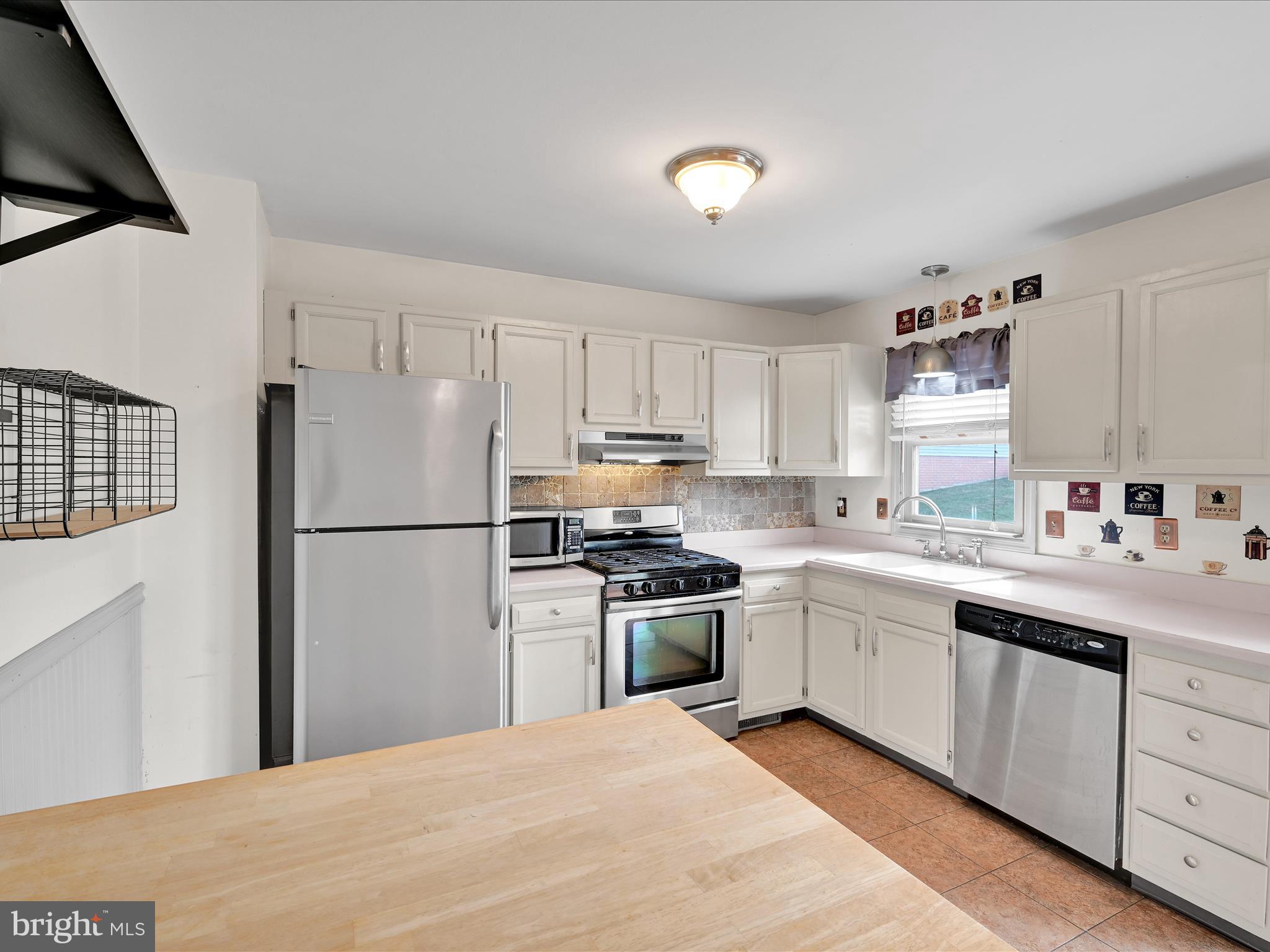 2140 Walnut Street Lebanon, PA 17042 - Photo 12 of 26 a kitchen with a sink stove and refrigerator