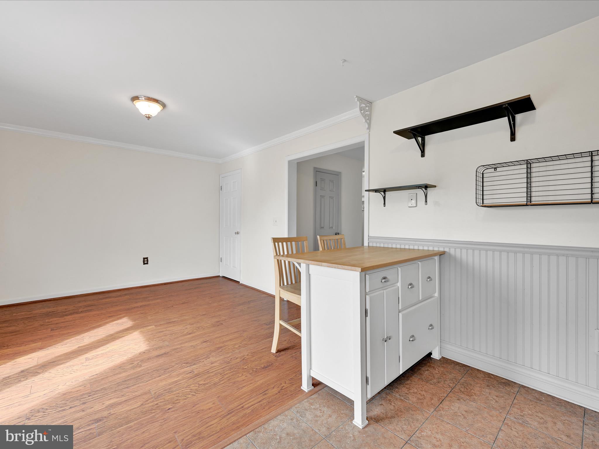 2140 Walnut Street Lebanon, PA 17042 - Photo 14 of 26 a kitchen with granite countertop white cabinets and a wooden floor
