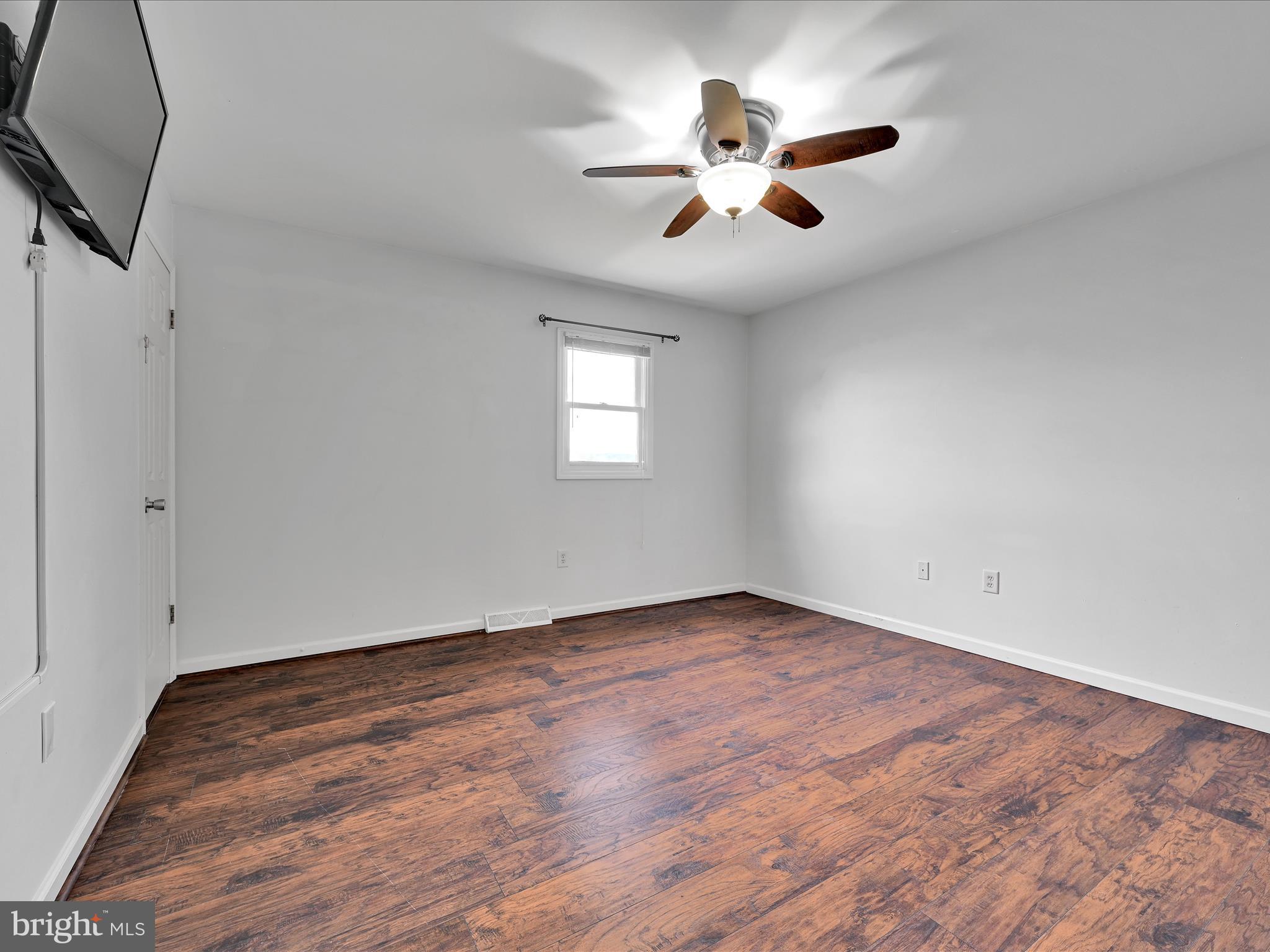 2140 Walnut Street Lebanon, PA 17042 - Photo 15 of 26 wooden floor in an empty room with a window