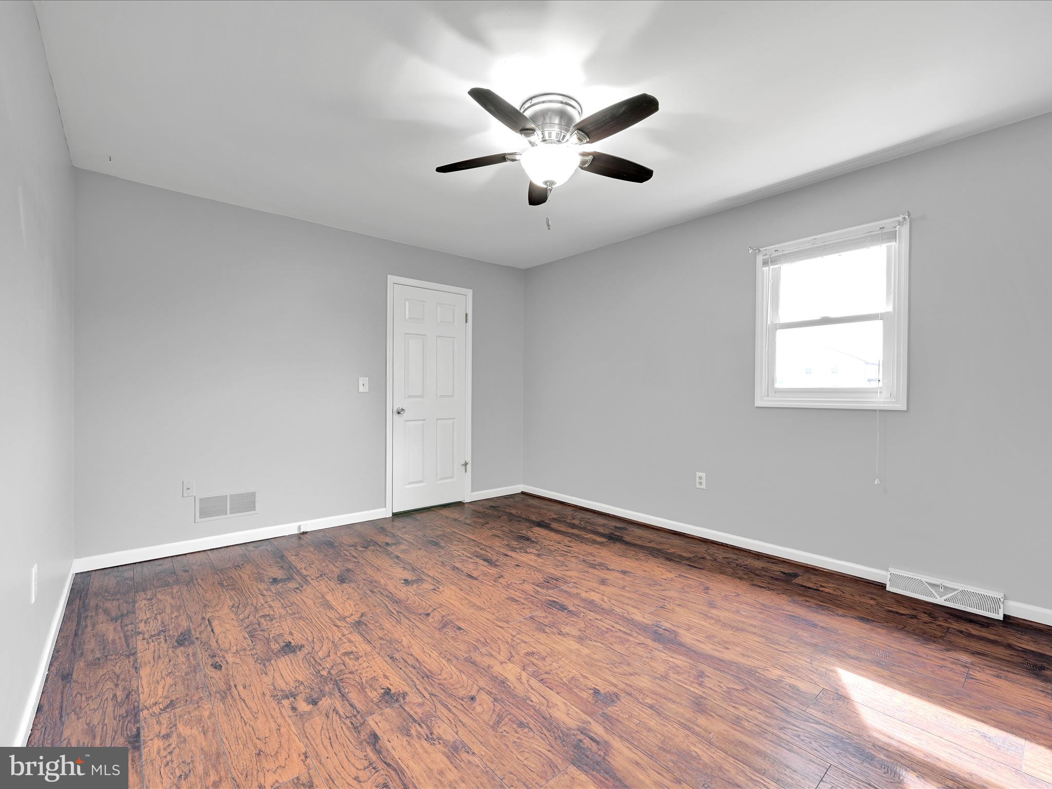 2140 Walnut Street Lebanon, PA 17042 - Photo 19 of 26 an empty room with wooden floor and windows