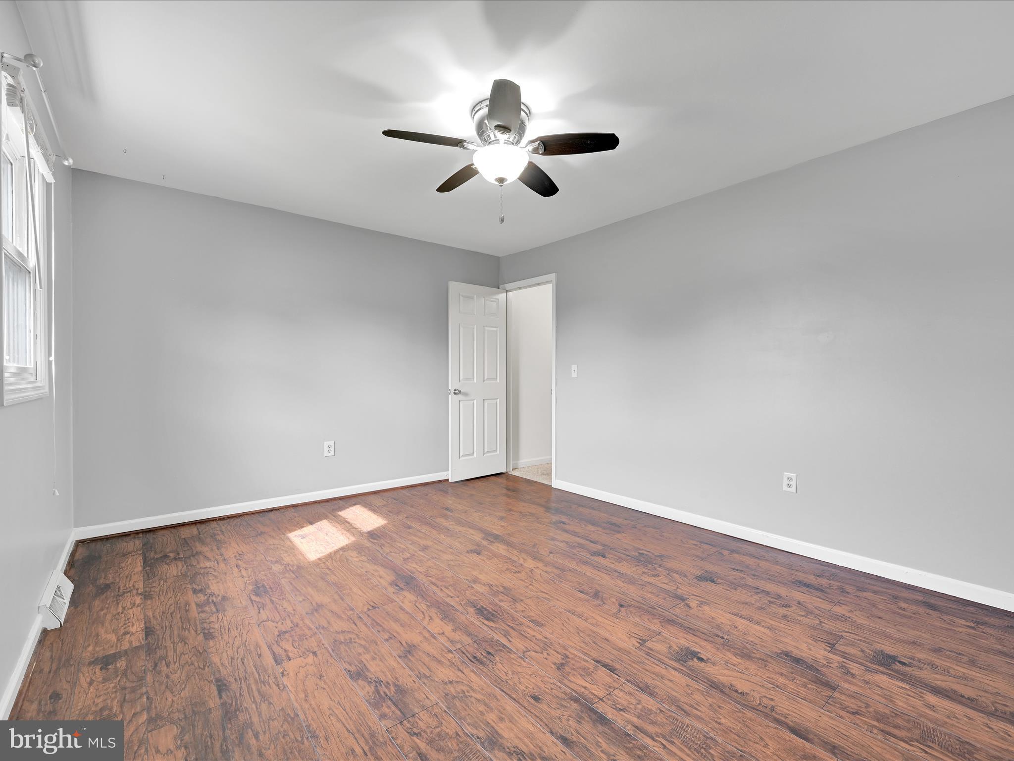 2140 Walnut Street Lebanon, PA 17042 - Photo 20 of 26 a view of an empty room with wooden floor and a window