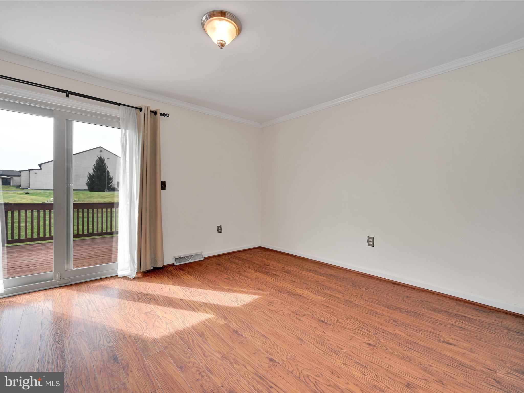2140 Walnut Street Lebanon, PA 17042 - Photo 8 of 26 an empty room with wooden floor and windows