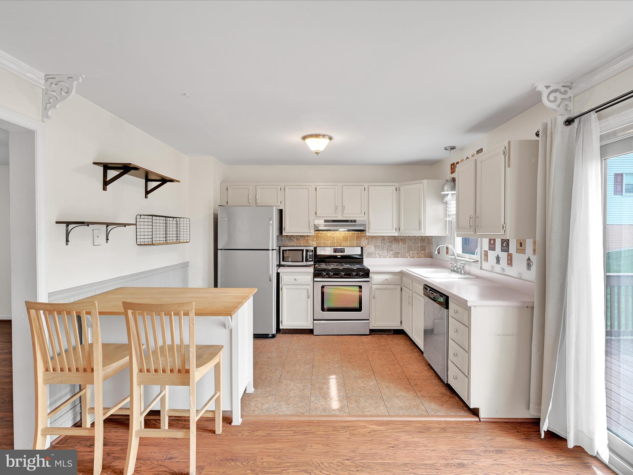 2140 Walnut Street Lebanon, PA 17042 - Photo 10 of 26 a kitchen with white cabinets and stainless steel appliances