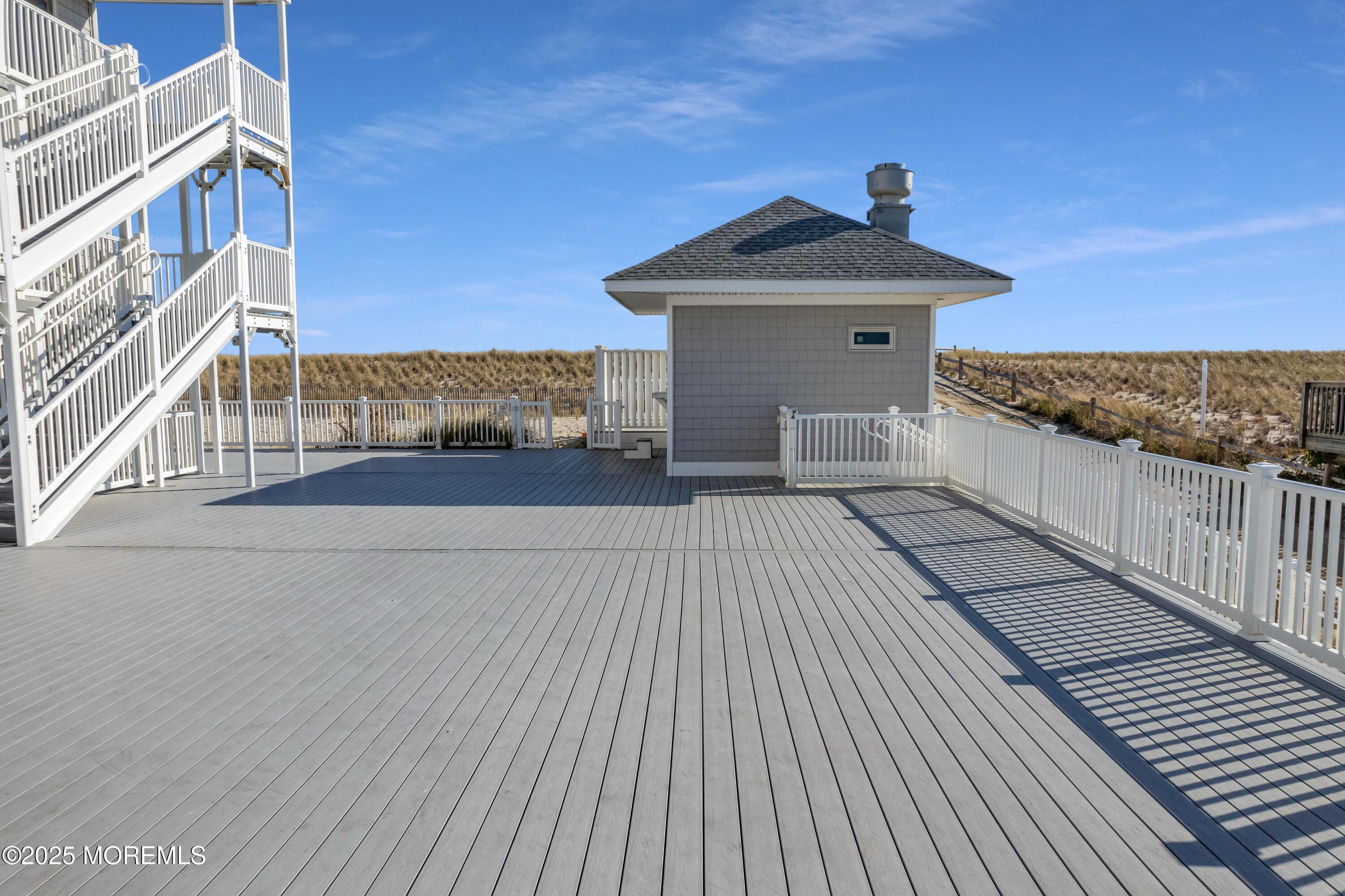 1 2nd Avenue, Unit 3 Seaside Heights, NJ 08751 - Photo 11 of 14 a view of a terrace with a bench
