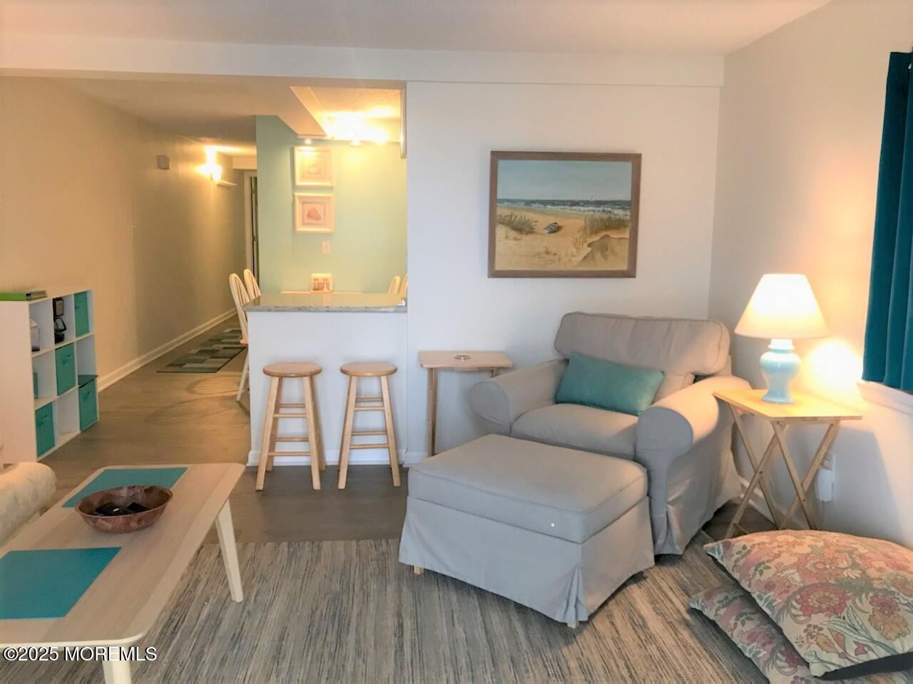 1 2nd Avenue, Unit 3 Seaside Heights, NJ 08751 - Photo 13 of 14 a living room with furniture and a table