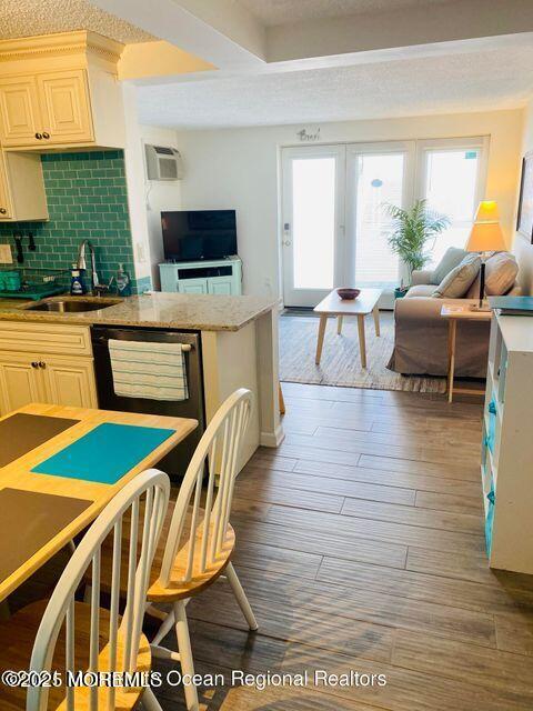 1 2nd Avenue, Unit 3 Seaside Heights, NJ 08751 - Photo 8 of 14 a living room with furniture a flat screen tv and a table