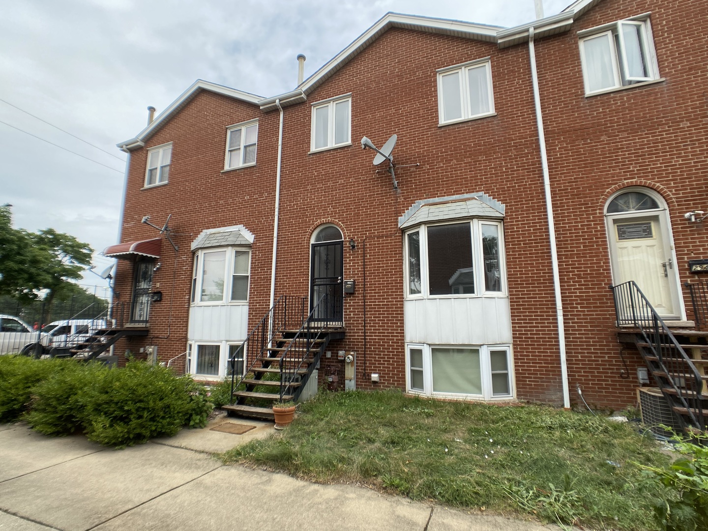 2949 South Halsted Street, Unit B Chicago, IL 60608 - Photo 1 of 22 a front view of a house with a yard