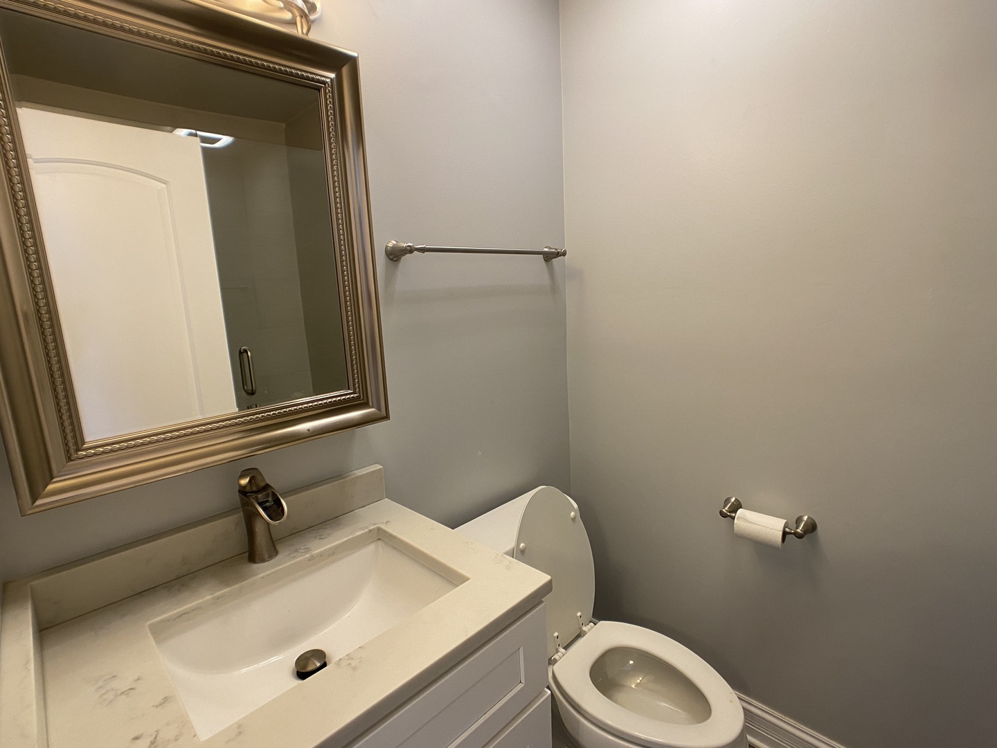 2949 South Halsted Street, Unit B Chicago, IL 60608 - Photo 15 of 22 a bathroom with a sink a toilet and mirror