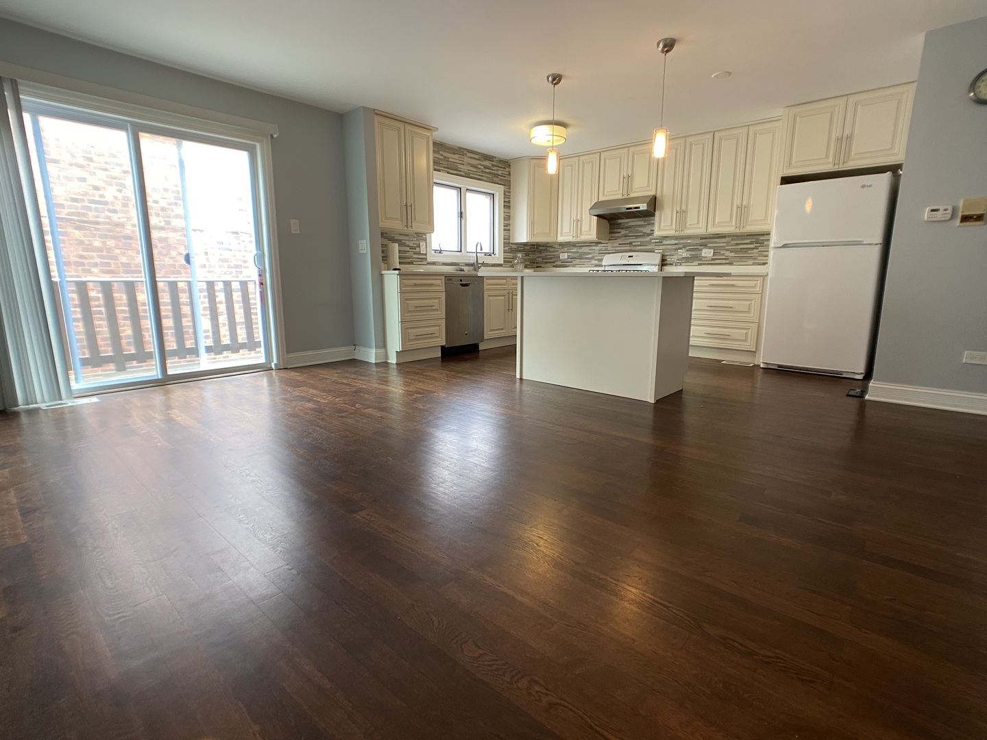 2949 South Halsted Street, Unit B Chicago, IL 60608 - Photo 2 of 22 a kitchen with a refrigerator and wooden floor