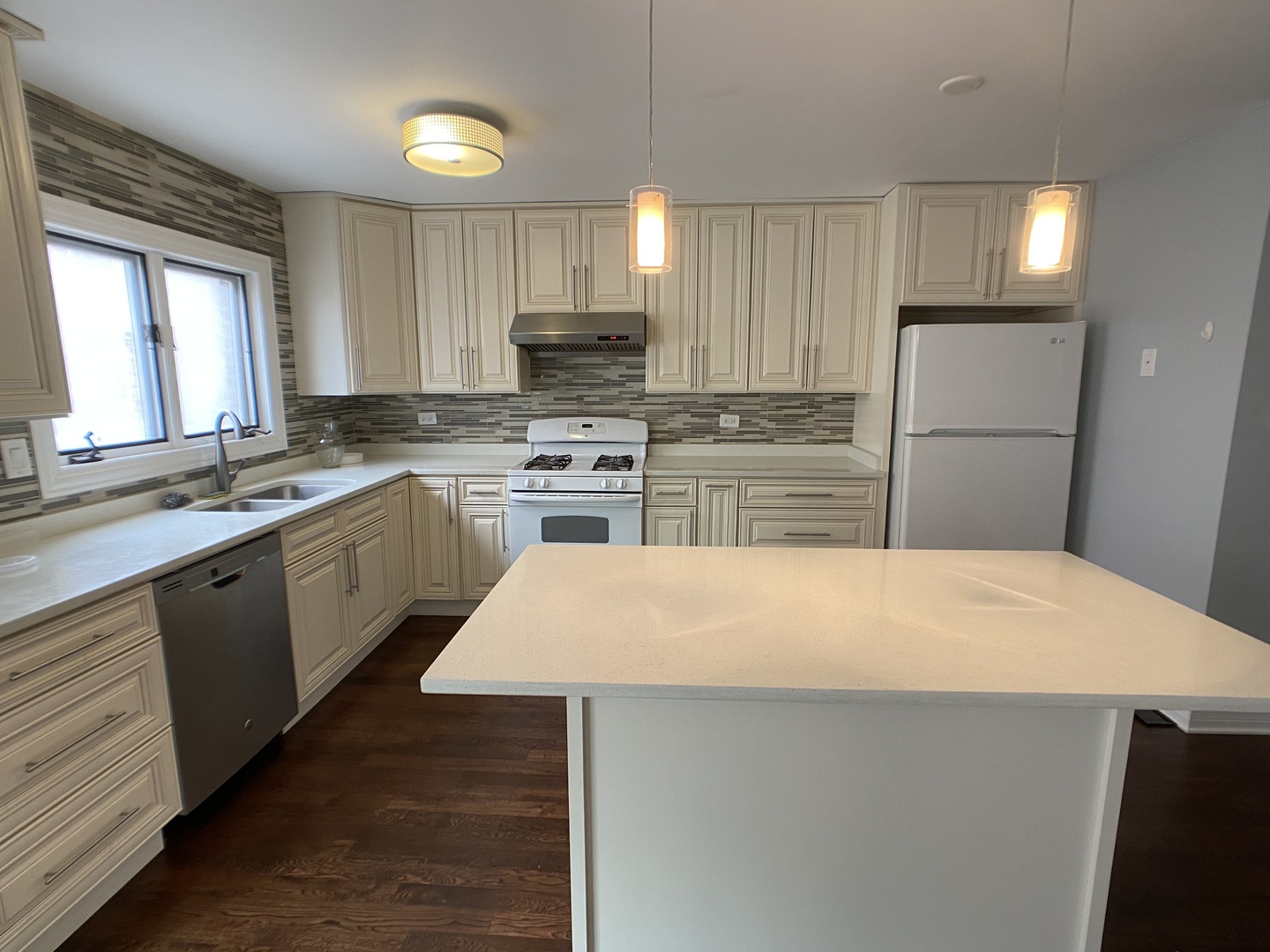 2949 South Halsted Street, Unit B Chicago, IL 60608 - Photo 3 of 22 a kitchen with stainless steel appliances a refrigerator sink and stove