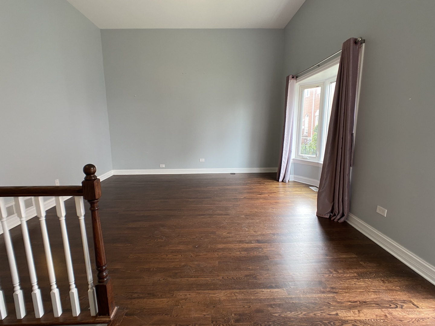 2949 South Halsted Street, Unit B Chicago, IL 60608 - Photo 7 of 22 a view of wooden floor and windows in a room