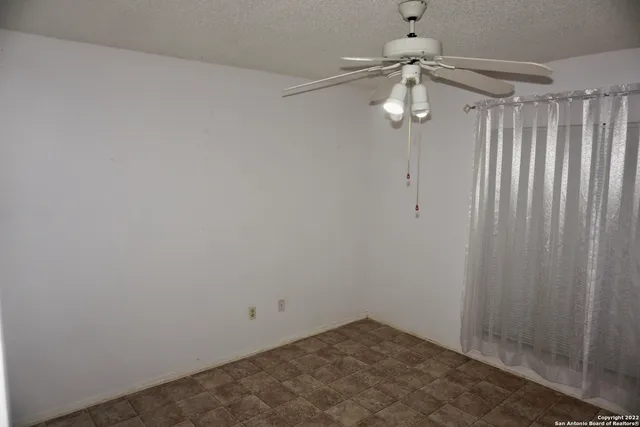 a view of a room with a fan